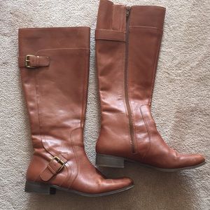 Tall brown boots with cute accent buckles!